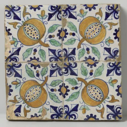 Field of four tiles with pomegranates split open