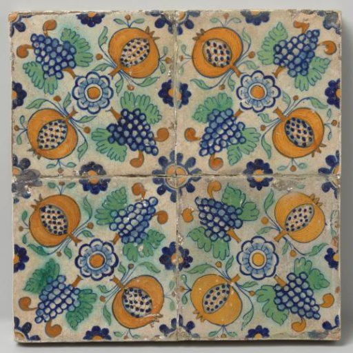 Field of four tiles with pomegranates, grapes, and rosettes