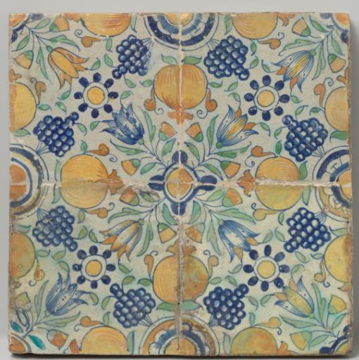 Field of four tiles forming a single rosette surrounded by tulips, pomegranates and grape clusters