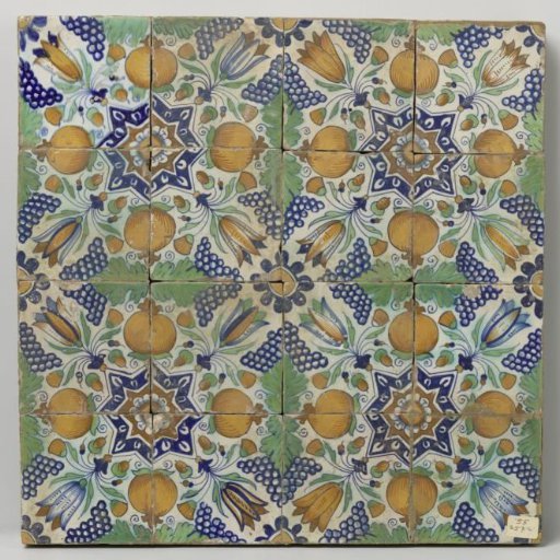 Panel of sixteen tiles with a pattern of grape clusters, tulips, pomegranates and stars