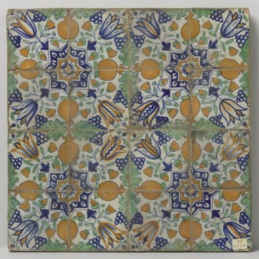 Panel of sixteen tiles with a pattern of grape clusters, tulips, pomegranates and stars