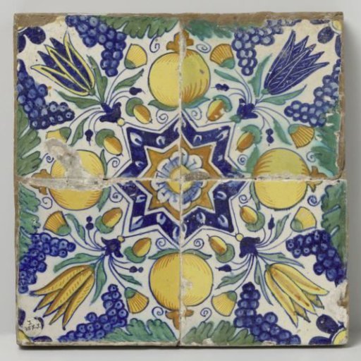 Panel of four tiles with a pattern of grape clusters, tulips, pomegranates and stars