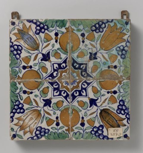 Panel of four tiles with a pattern of grape clusters, pomegranates, tulips and stars