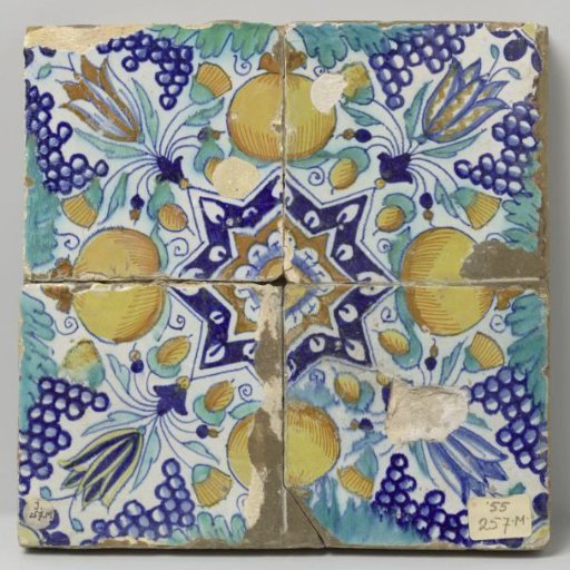 Field of four tiles with a pattern of grape clusters, stars, tulips and pomegranates