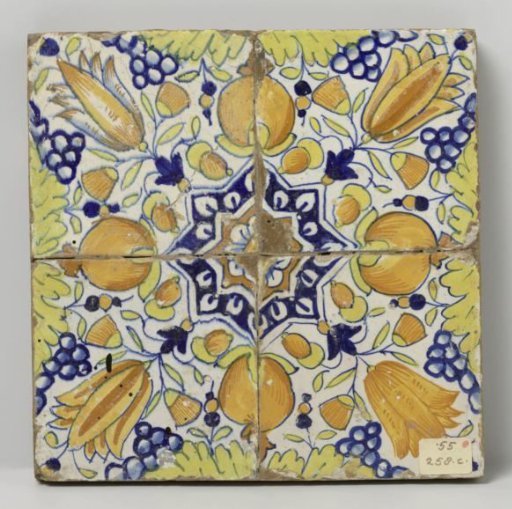 Field of four tiles with a pattern of grape clusters, pomegranates, tulips and stars