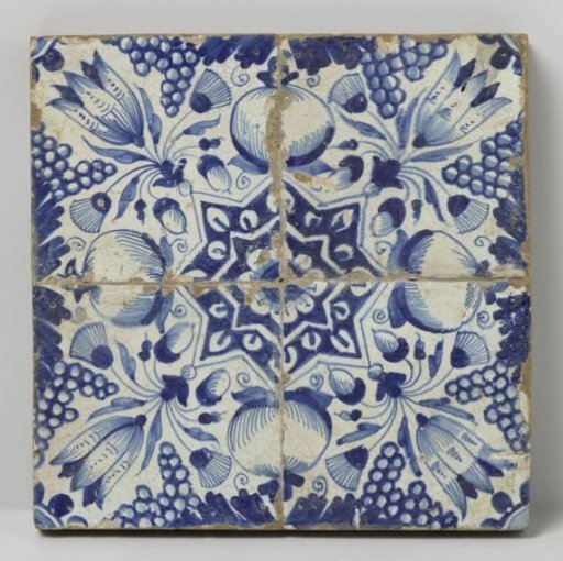 Field of four tiles with a pattern of grape clusters, pomegranates, tulips, and stars