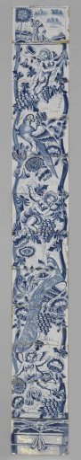 Tile tableau with a fluted column painted in blue, around which are draped flowers, grape clusters, a peacock, a parrot, and three putti, with Tobias and the Angel at the top