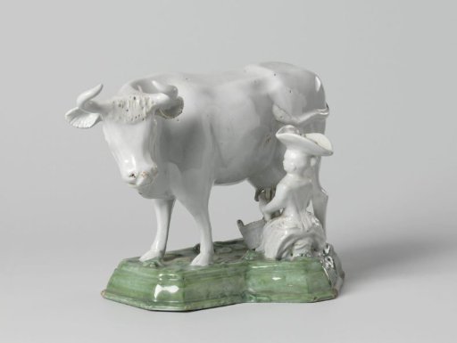 Cow with milkmaid, on a green pedestal