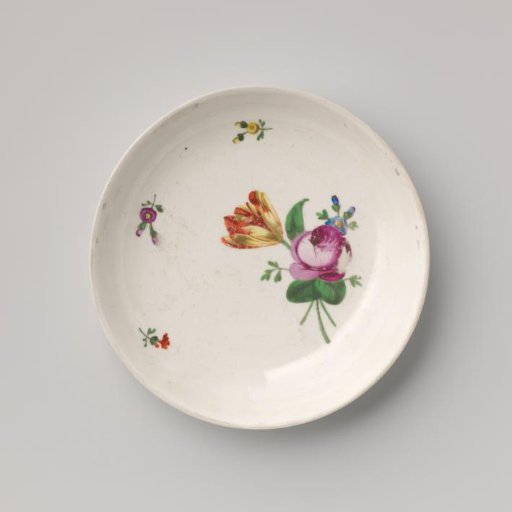 Saucer with a bouquet and flower sprays