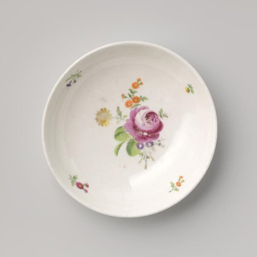 Saucer with a bouquet and flower sprays