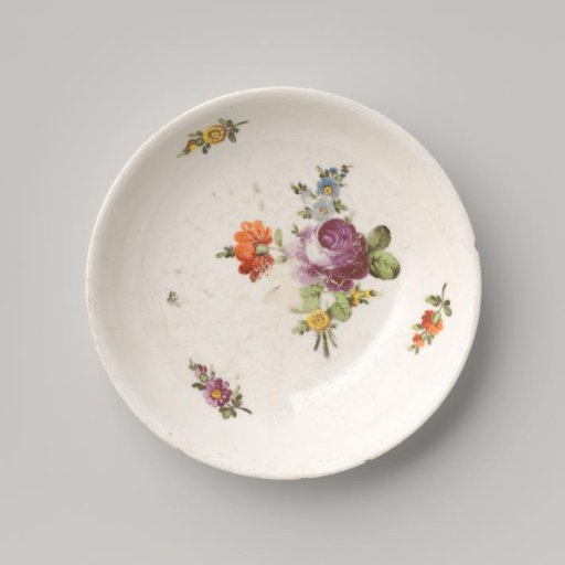 Saucer with a bouquet and flower sprays