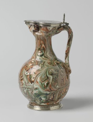 Tankard with silver lid featuring a coat of arms with a crest