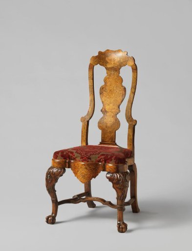 Chair of walnut with a loose upholstered seat, frame with panes and floral motifs in marquetry; back with a carved central leaf with a flower vase, S-shaped legs