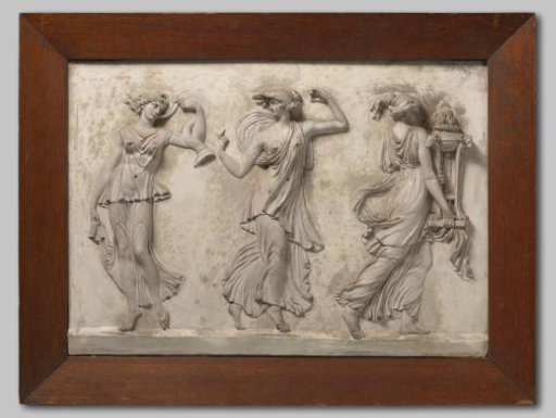 Overdoor of plaster depicting three dancing and music-making women. One carries a burning fire on a tripod with ram's heads. In an oak frame