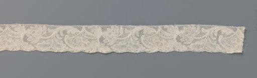 Strip of bobbin lace with lotus flower