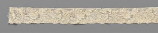 Strip of bobbin lace with lotus flower