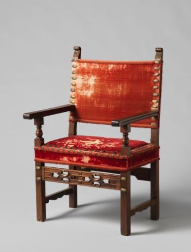 Mahogany chair with square legs. Partially carved and partially openwork. Upholstered in red velvet.