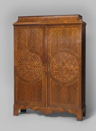 Cabinet, veneered with several types of wood. Doors with a circular field in the center featuring a cube pattern surrounded by a diamond pattern.