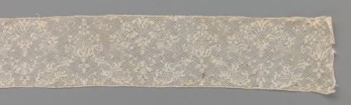 Strip of bobbin lace with two shield-shaped main motifs