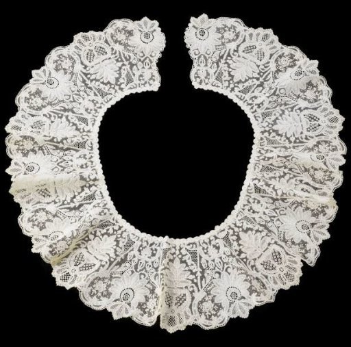 Collar of mixed lace with rosette set in S-scrolls and a vase with seven-leaf