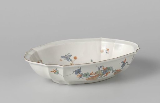 Bowl with a squirrel and flowering plants near a rock