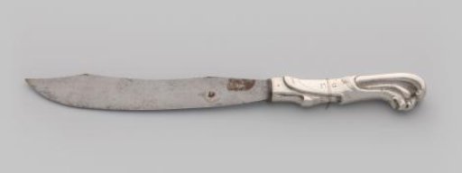 Knife with handle consisting of tassel motifs topped with a grotesque mask