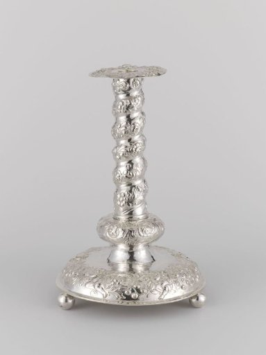 Candlestick with a twisted stem, decorated with flowers and putti