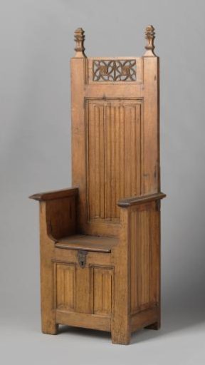 Oak chair with a closed chest-like base.