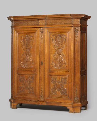 Cabinet with two doors. The upper panels bear two onion-shaped ornaments between which is a medallion with initials.