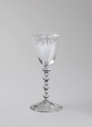 Chalice glass with an ornamental border