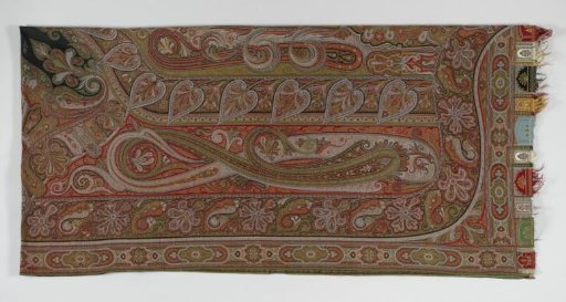Long Kashmiri shawl woven of multicolored wool, with a black field, around which a full pattern of palmettes and leaves