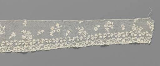 Engagement piece of appliqué lace with a symmetrical scattered pattern of flowers and flower sprigs