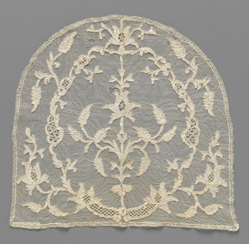 Lace cap cushion with iris in oval cartouche