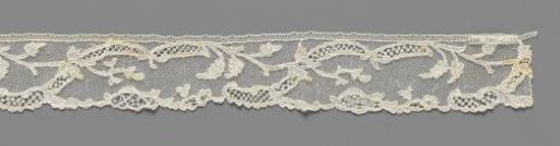 Strip of needle lace with mirrored S-shaped ornamental band and iris