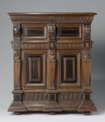 Miniature oak cabinet with two drawers between the doors in the upper and lower sections