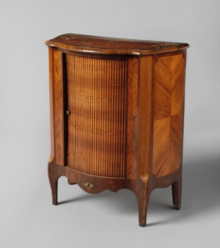 Cabinet with Louvered Door and Stiles Decorated with Herringbone Pattern.