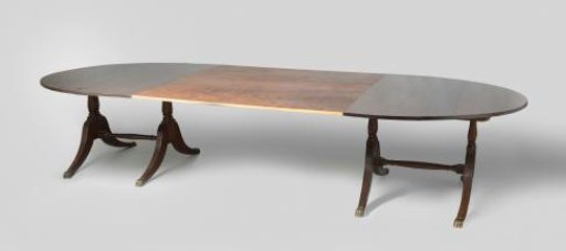 Table with oval top and bracket-shaped legs ending in copper claws