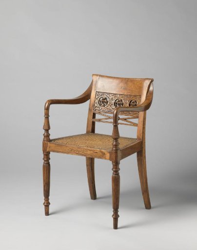 Armchair with a Wicker Seat on Fluted Baluster-Shaped Front Legs. Back with a High Crossrail Decorated with Three Open Circles with Flower and Pierced Leafwork