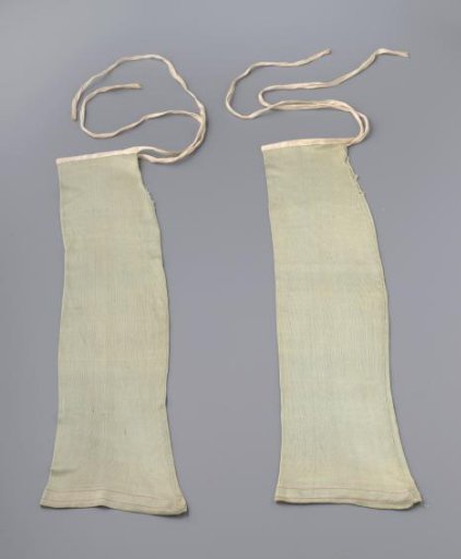 Stocking (?) of turquoise silk tricot, without a foot, with long ecru-colored linen ribbons at the seams