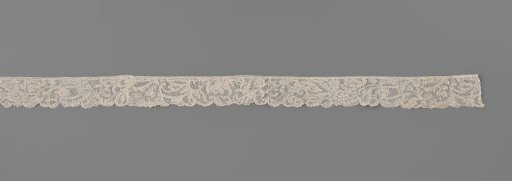 Strip of needle lace with acanthus leaves