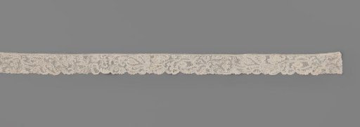 Strip of needle lace with acanthus leaves