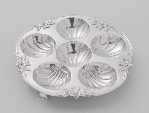 Oyster plate with six shell-shaped compartments