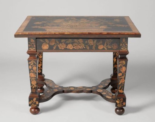 Table with a Basket with Flowers