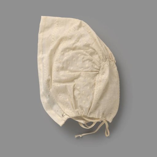 Child's Cap of Strongly Starched Cotton (?) with Very Fine White Embroidery in the Form of Stylized Leaf Vines and a Straw Motif; Behind Two Ribbon Ties
