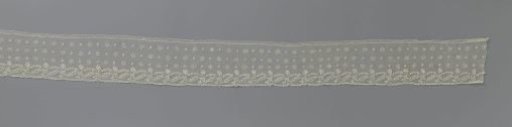 Strip of needle lace with knots and star-shaped flowers