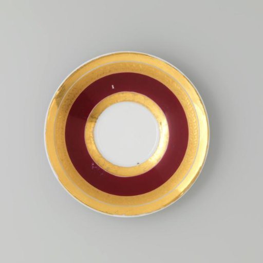 Saucer with gold borders on a red ground