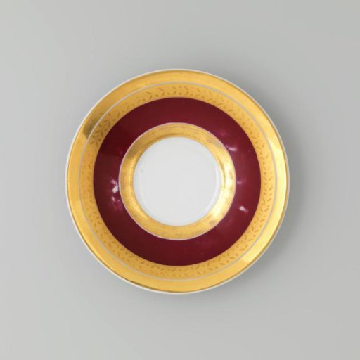 Saucer with gold borders on a red ground