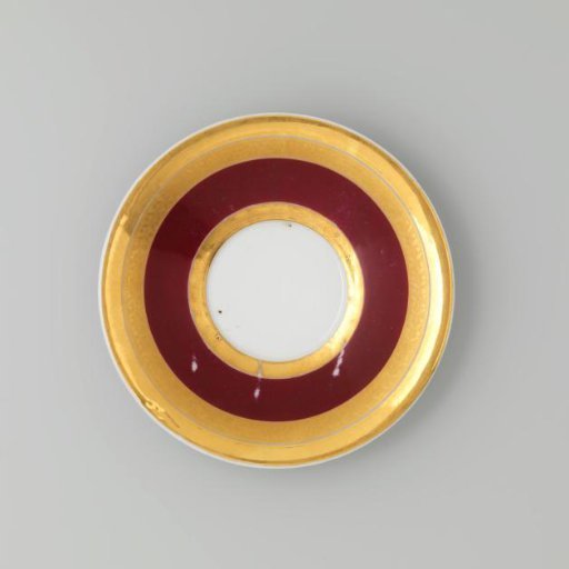 Saucer with gold borders on a red ground