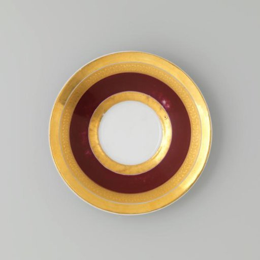Saucer with gold borders on a red ground