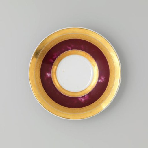 Saucer with gold borders on a red ground